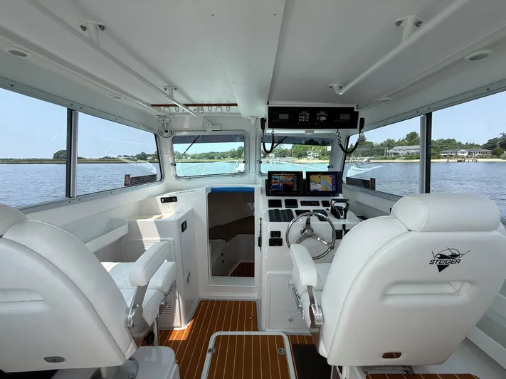  Yacht Photos Pics Interior of 2021 Steiger Craft 31 Chesapeake boat with modern navigation equipment.