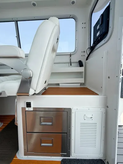  Yacht Photos Pics Interior of 2021 Steiger Craft 31 Chesapeake boat with seating and storage drawers.