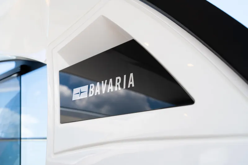  Yacht Photos Pics Bavaria SR41 2022 yacht logo on sleek white exterior.