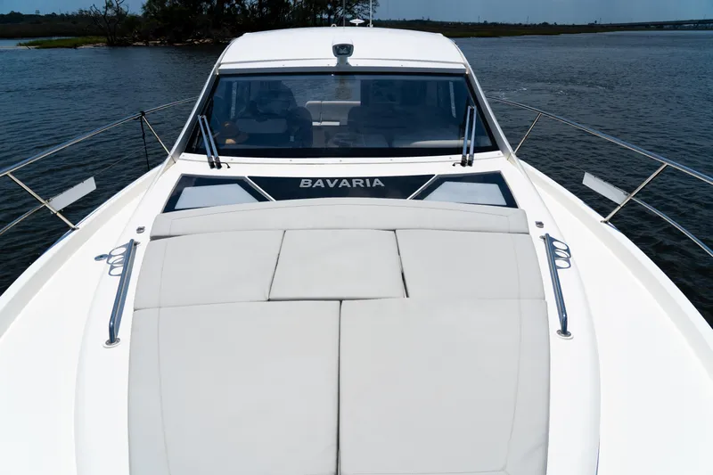  Yacht Photos Pics 2022 Bavaria SR41 yacht on water, showcasing sleek design and spacious deck.