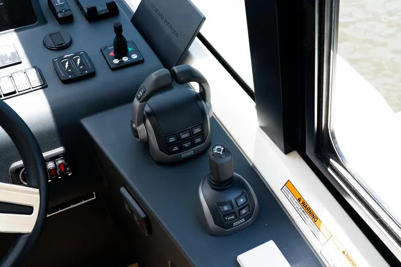  Yacht Photos Pics Control panel of 2022 Bavaria SR41 boat with joystick and throttle controls.