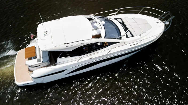  Yacht Photos Pics 2022 Bavaria SR41 yacht cruising on water, aerial view.
