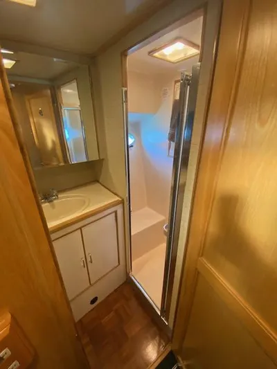  Yacht Photos Pics Bathroom interior of 1989 Ocean Alexander 42 yacht, featuring sink and shower.