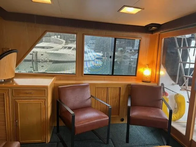  Yacht Photos Pics Interior of 1989 Ocean Alexander 42 yacht with two chairs and a window view.
