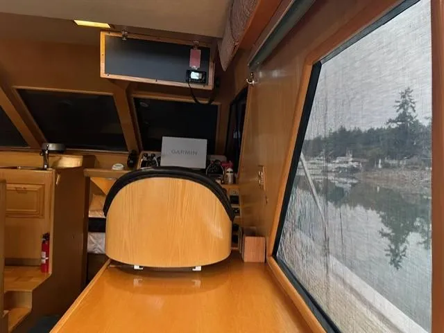  Yacht Photos Pics Interior of 1989 Ocean Alexander 42 yacht with navigation equipment and scenic window view.