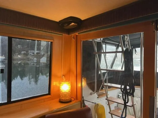  Yacht Photos Pics Interior view of 1989 Ocean Alexander 42 yacht with window and cozy lighting.