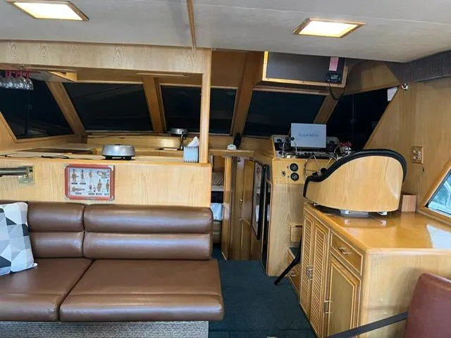  Yacht Photos Pics Interior of 1989 Ocean Alexander 42 yacht with leather seating and navigation equipment.