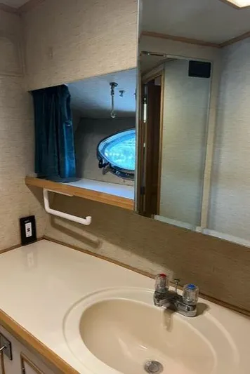  Yacht Photos Pics Bathroom interior of 1989 Ocean Alexander 42 yacht, featuring sink and mirror.