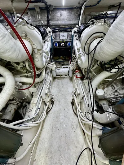 Billie Jo Yacht Photos Pics Engine room of a 1994 Hatteras 46 Convertible yacht, showcasing dual engines.