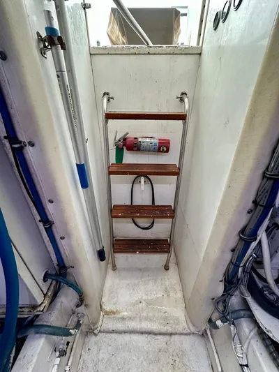 Billie Jo Yacht Photos Pics Ladder on 1994 Hatteras 46 Convertible boat with fire extinguisher.