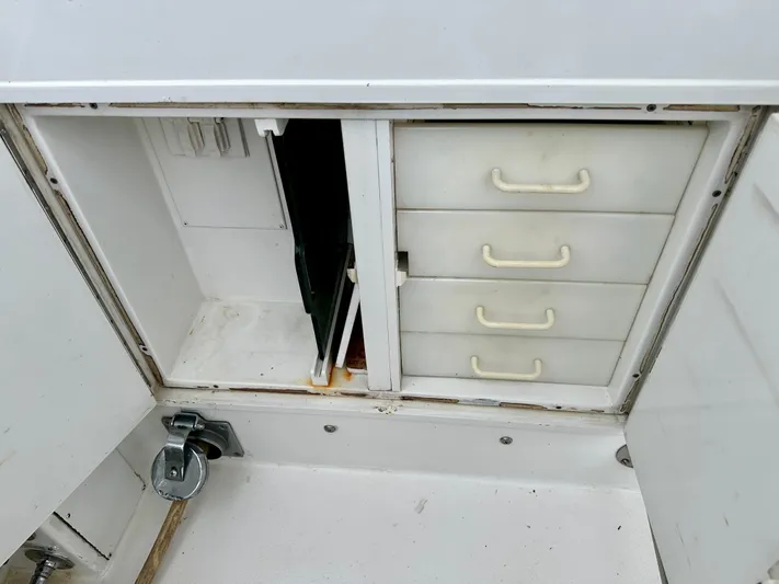 Billie Jo Yacht Photos Pics Storage compartment with drawers on a 1994 Hatteras 46 Convertible boat.