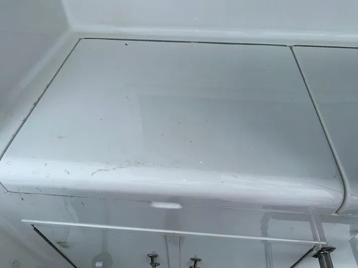 Billie Jo Yacht Photos Pics Hatteras 46 Convertible 1994 boat interior storage compartment with white finish.