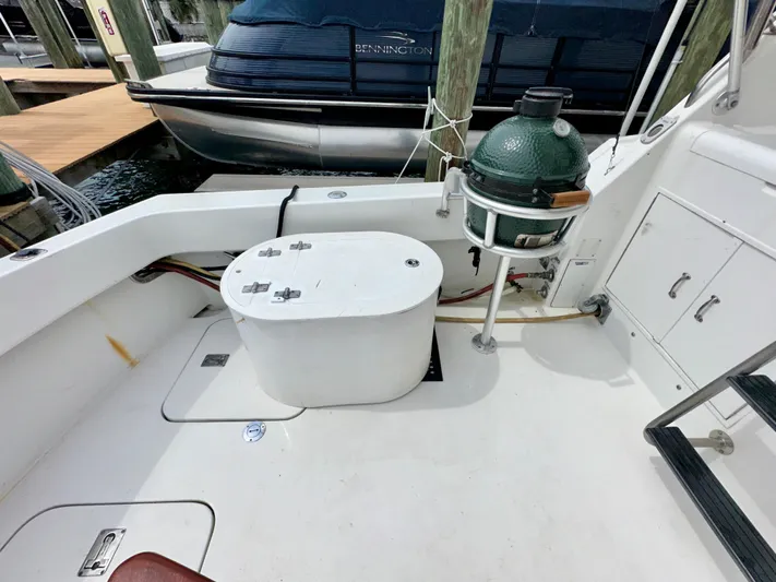 Billie Jo Yacht Photos Pics 1994 Hatteras 46 Convertible boat deck with grill and storage compartments.