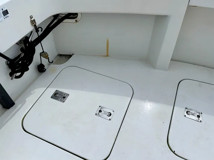 Billie Jo Yacht Photos Pics 1994 Hatteras 46 Convertible boat deck with storage hatches and utility cables.