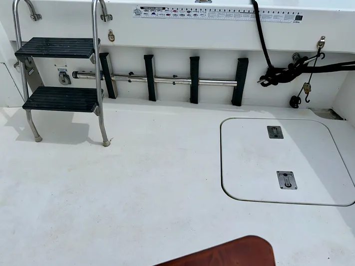 Billie Jo Yacht Photos Pics 1994 Hatteras 46 Convertible boat deck with ladder and storage compartments.