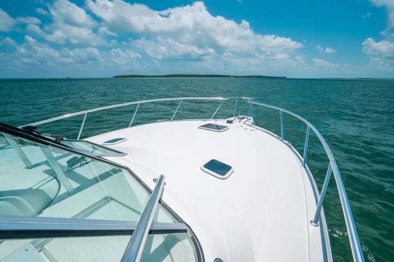  Yacht Photos Pics 2007 Rampage 38 Express boat cruising on open water under a clear blue sky.