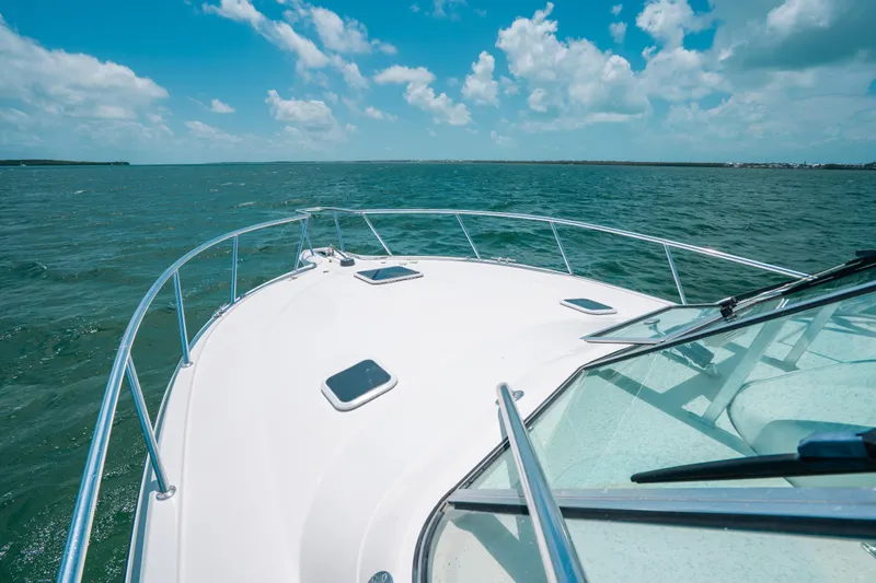  Yacht Photos Pics 2007 Rampage 38 Express boat cruising on open water under a clear blue sky.