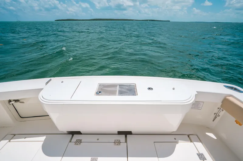  Yacht Photos Pics 2007 Rampage 38 Express boat deck overlooking ocean and distant island.