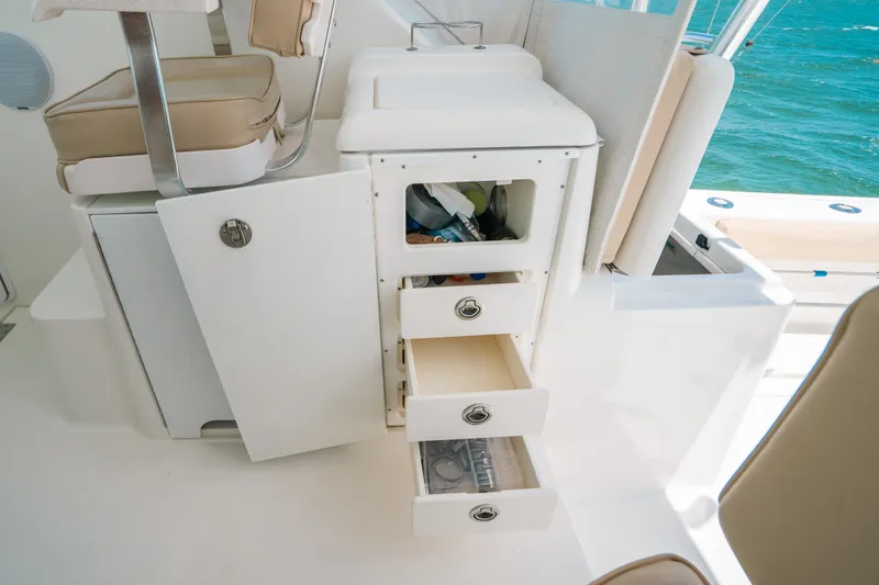  Yacht Photos Pics 2007 Rampage 38 Express boat interior with open storage compartments and drawers.