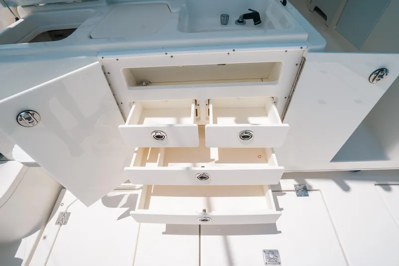  Yacht Photos Pics Open storage drawers and cabinet on 2007 Rampage 38 Express boat.