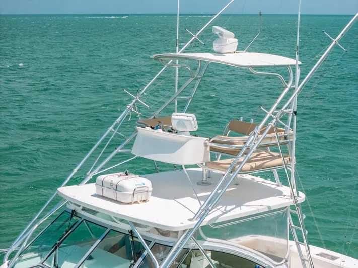  Yacht Photos Pics 2007 Rampage 38 Express boat on open sea with fishing tower and equipment.