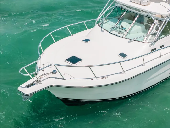  Yacht Photos Pics 2007 Rampage 38 Express boat on turquoise water, aerial view.