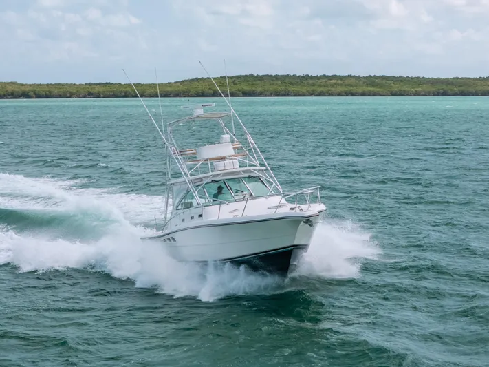  Yacht Photos Pics 2007 Rampage 38 Express boat cruising on open water.
