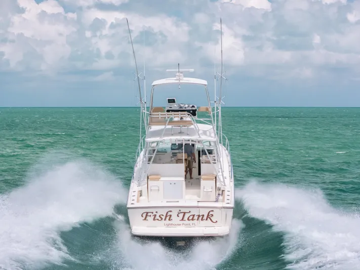  Yacht Photos Pics 2007 Rampage 38 Express boat cruising on open water, rear view.