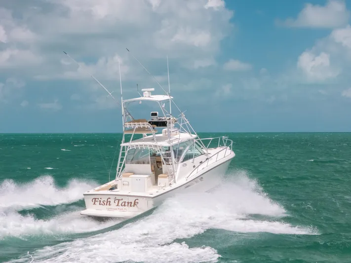  Yacht Photos Pics 2007 Rampage 38 Express boat cruising on open sea under clear skies.