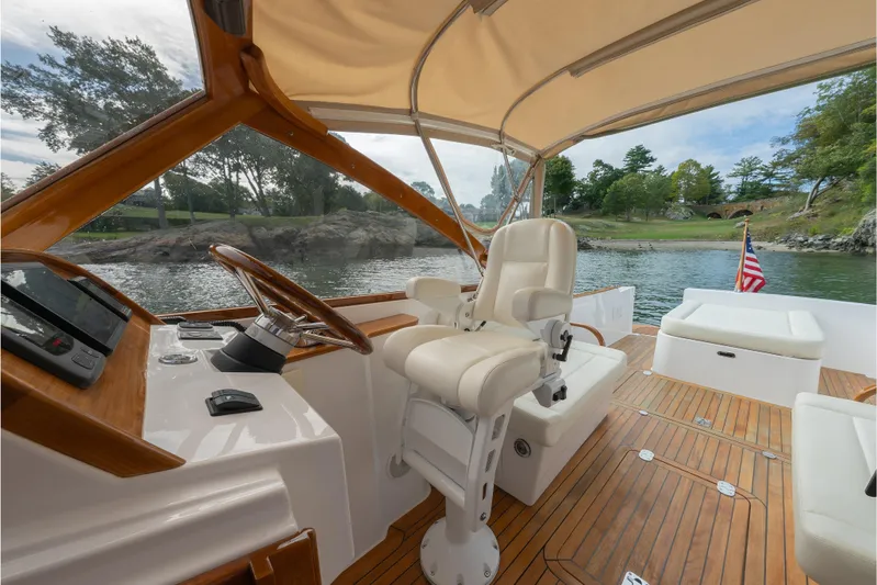Eloise Yacht Photos Pics 2020 CH Marine Shelter Island Nomad boat interior with helm, seating, and scenic water view.