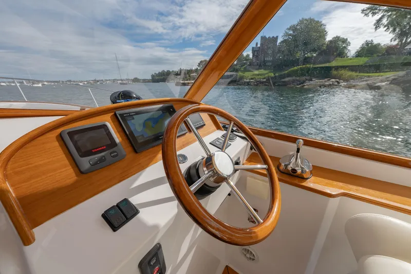 Eloise Yacht Photos Pics 2020 CH Marine Shelter Island Nomad boat interior with steering wheel and navigation system.