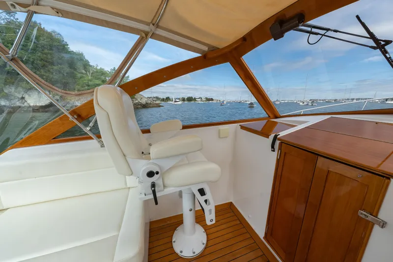 Eloise Yacht Photos Pics Interior view of 2020 CH Marine Shelter Island Nomad boat with scenic ocean backdrop.