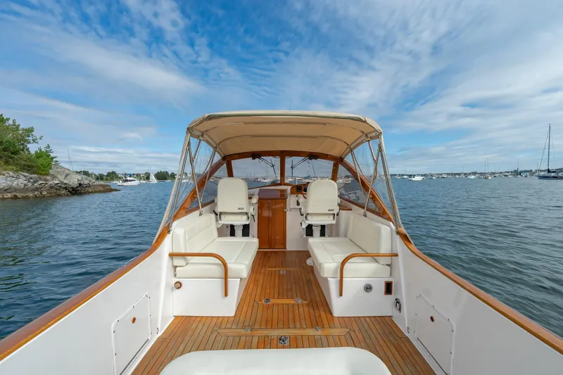 Eloise Yacht Photos Pics 2020 CH Marine Shelter Island Nomad boat interior with seating, on calm water.
