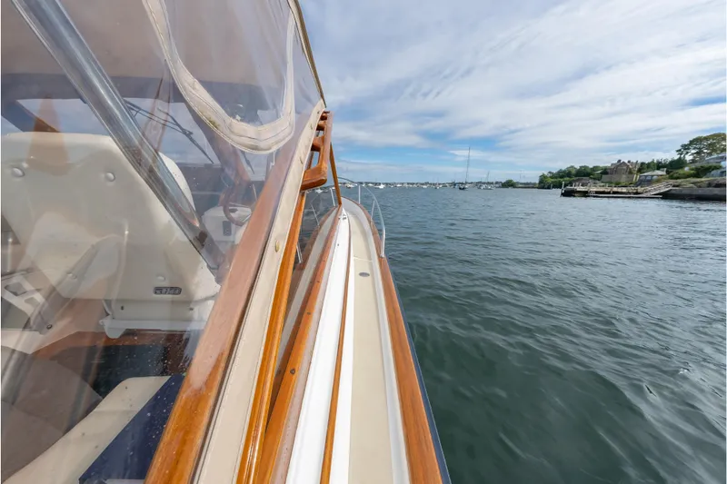 Eloise Yacht Photos Pics 2020 CH Marine Shelter Island Nomad boat cruising on a calm, scenic waterway.