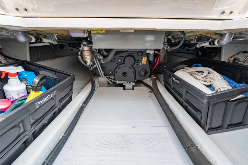 Eloise Yacht Photos Pics 2020 CH Marine Shelter Island Nomad engine compartment with storage crates and maintenance supplies.
