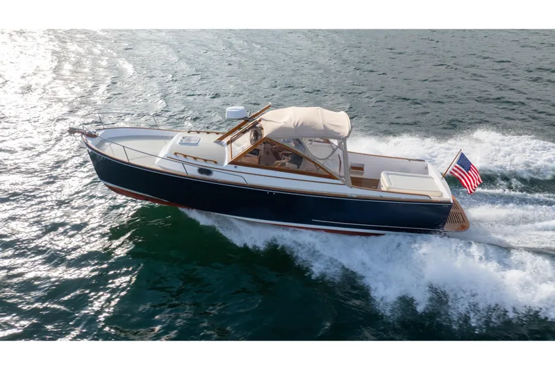 Eloise Yacht Photos Pics 2020 CH Marine Shelter Island Nomad cruising on open water with American flag.