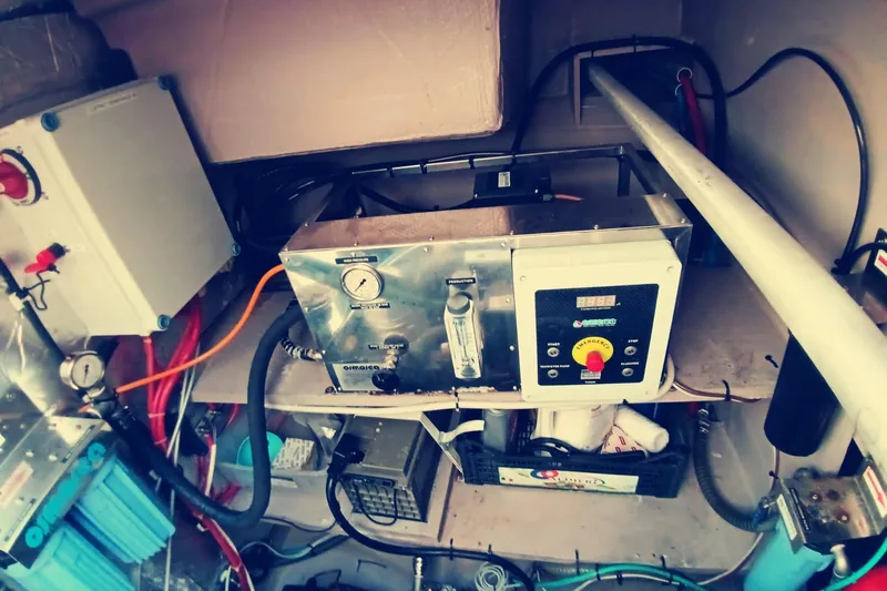  Yacht Photos Pics Engine room of a 2021 Bali Catamarans 4.8, showcasing technical equipment and wiring.