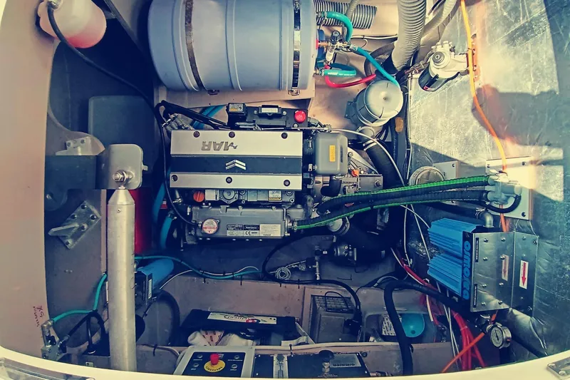  Yacht Photos Pics Engine compartment of a 2021 Bali Catamarans 4.8, showcasing mechanical components and wiring.