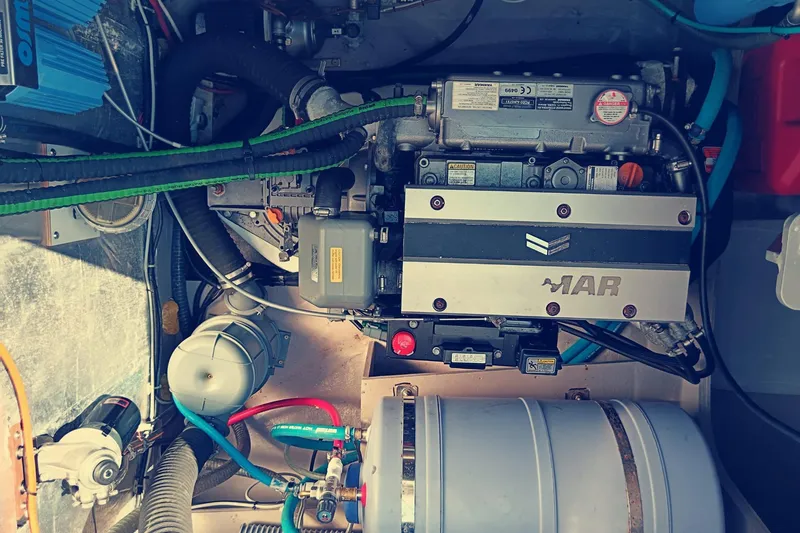  Yacht Photos Pics Engine room of a 2021 Bali Catamarans 4.8, showcasing mechanical components and wiring.