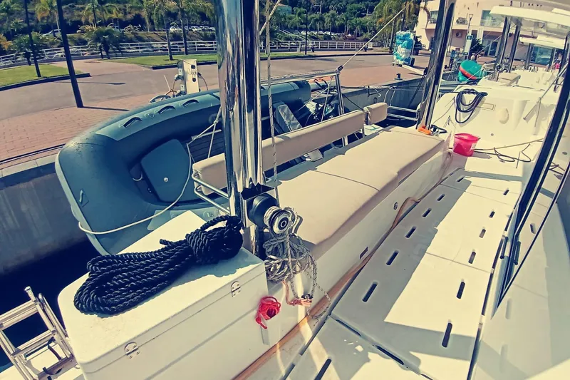  Yacht Photos Pics 2021 Bali Catamarans 4.8 docked, featuring deck seating and nautical equipment.