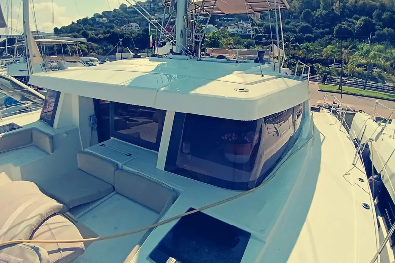  Yacht Photos Pics 2021 Bali Catamarans 4.8 yacht docked, showcasing sleek design and spacious deck.