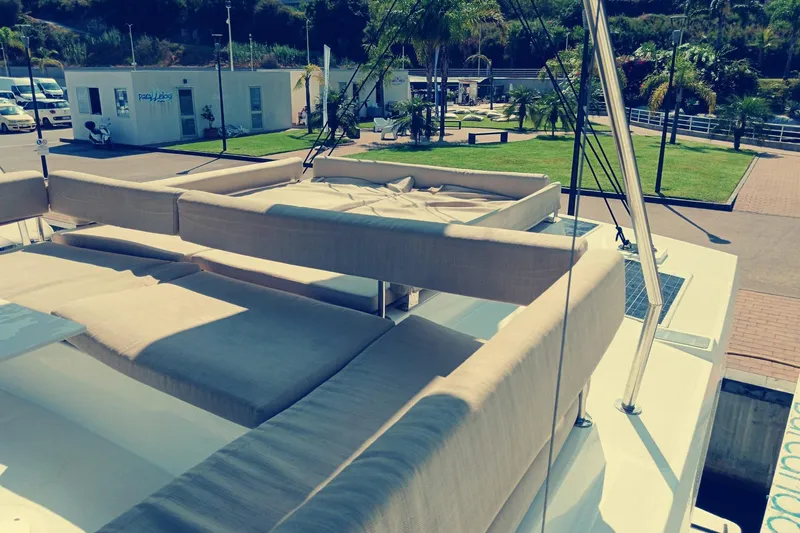  Yacht Photos Pics Luxurious 2021 Bali Catamarans 4.8 with spacious deck seating in a marina setting.