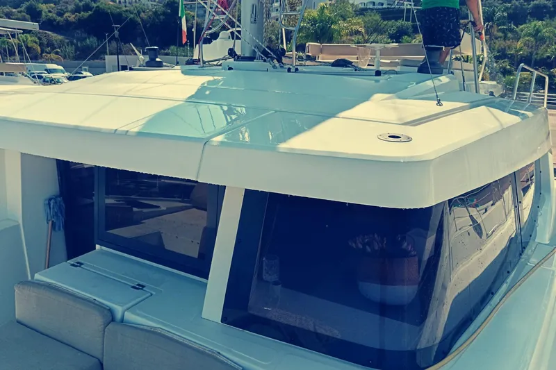  Yacht Photos Pics 2021 Bali Catamarans 4.8 yacht docked, showcasing sleek design and spacious deck.