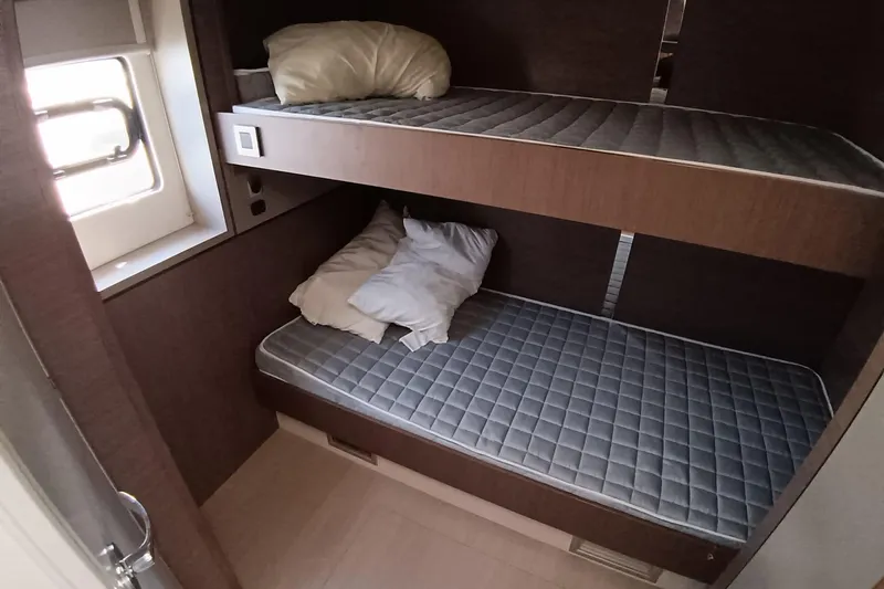  Yacht Photos Pics Bunk beds in 2021 Bali Catamarans 4.8 cabin with window and pillows.