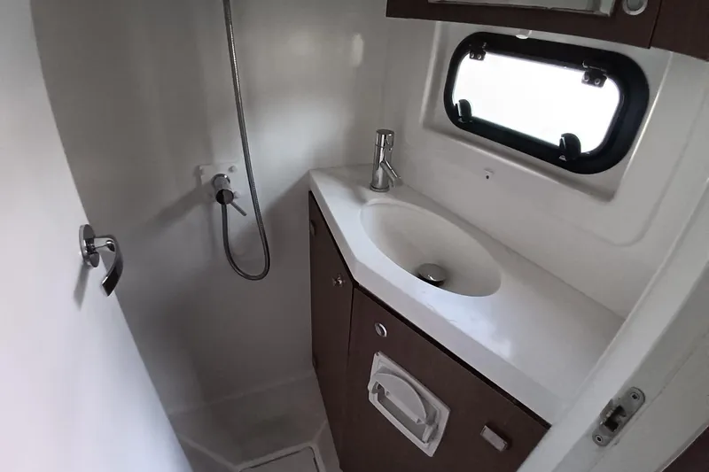  Yacht Photos Pics 2021 Bali Catamarans 4.8 bathroom with modern sink, shower, and window.
