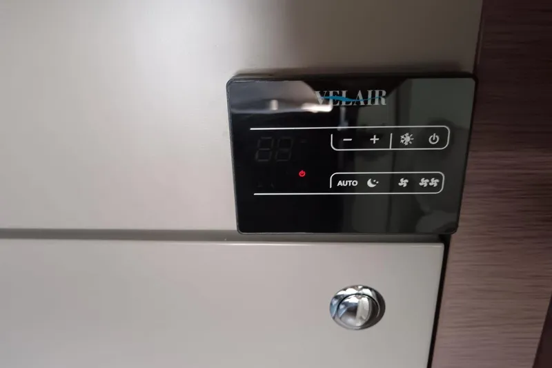  Yacht Photos Pics Control panel of a 2021 Bali Catamarans 4.8, featuring digital display and buttons.