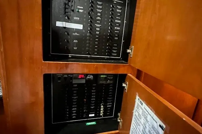 Kiki's Tiki Yacht Photos Pics Electrical panel inside a 2000 Carver 506 Motor Yacht, featuring control switches and indicators.