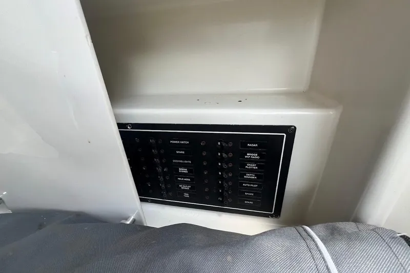 Kiki's Tiki Yacht Photos Pics Control panel of a 2000 Carver 506 Motor Yacht, featuring various switches and labels.