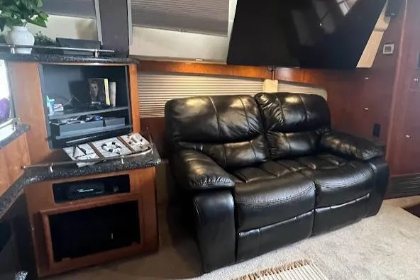 Kiki's Tiki Yacht Photos Pics Luxurious interior of 2000 Carver 506 Motor Yacht with leather seating and entertainment system.