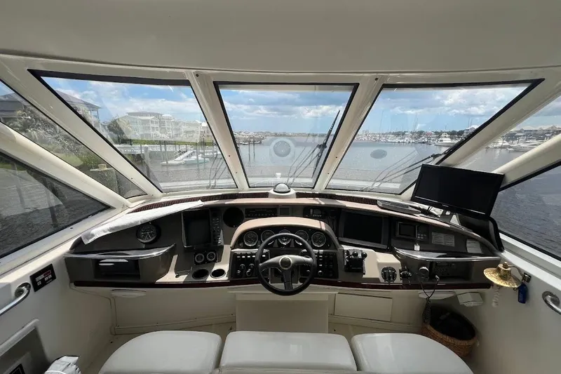 Kiki's Tiki Yacht Photos Pics Helm of 2000 Carver 506 Motor Yacht with panoramic marina view.